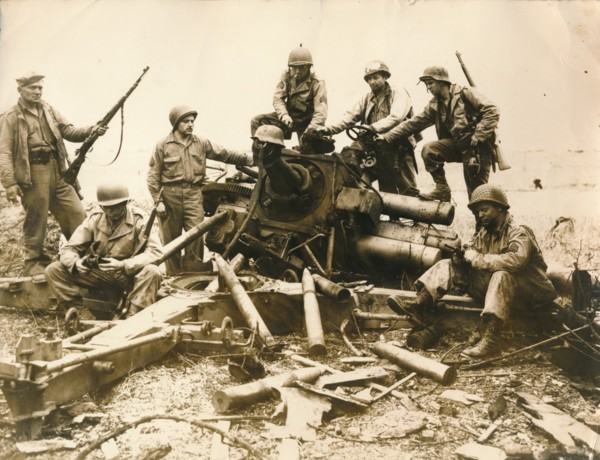 American troops looking for souvenir near Cherbourg airport, July 1944. Artist: Unknown