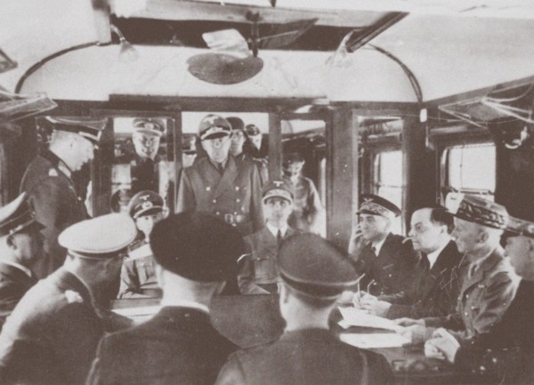 The German and French delegations inside a railroad car at Compiègne for the signing of France's sur Artist: Anonymous