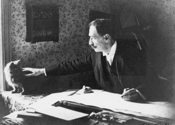 Louis Wain at his drawing board, 1890s. Artist: Anonymous