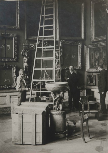 Preparing paintings for evacuation from one of the Italian halls at the Hermitage, 1917.