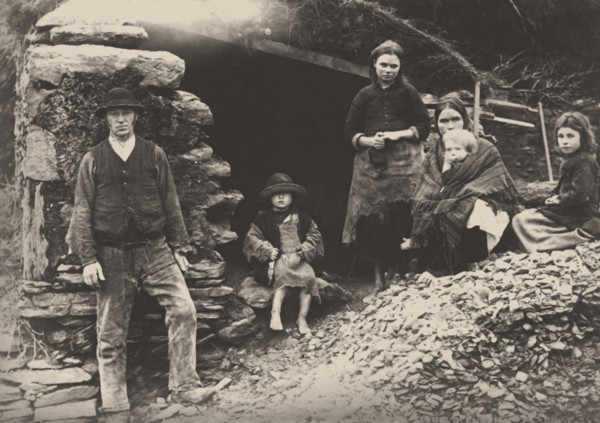 The Great Famine. A family at the ruins of their house in Killarney, 1888.