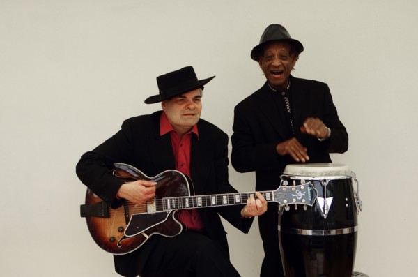Frank Holder, Guyanan jazz singer and percussionist with Shane Hill, guitarist.   Artist: Brian O'Connor