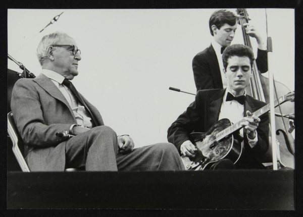 Benny Goodman watching Phil Flanigan and Chris Flory, Knebworth, Hertfordshire, 1982. Artist: Denis Williams