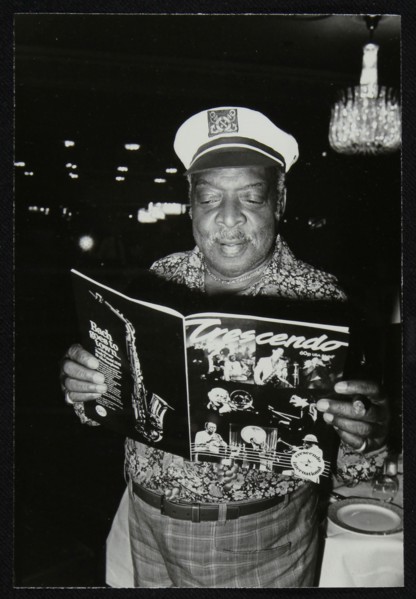 Count Basie reading a copy of Crescendo magazine at the Grosvenor House Hotel, London, 1979. Artist: Denis Williams
