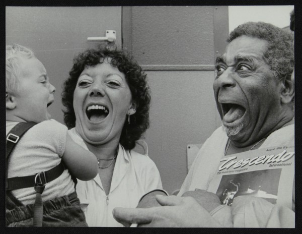 Dizzy Gillespie meeting baby Gary Colfer at Knebworth, Hertfordshire, July 1982. Artist: Denis Williams