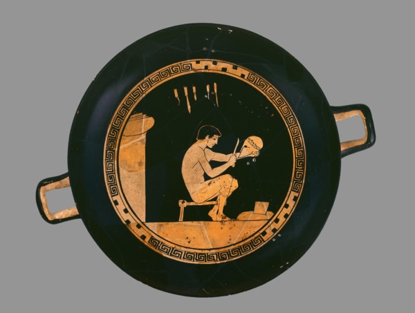 Attic red-figure cup depiting a seated helmet maker and his equipment, c480 BC. Artist: Antiphon Painter.