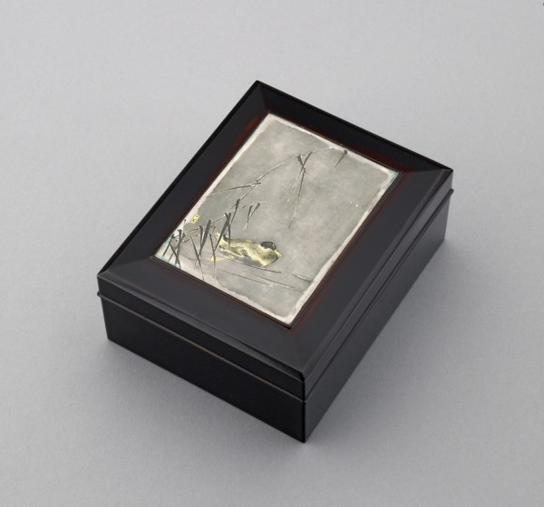 Box with plaque depicting a duck swimming past reeds, probably before 1908. Artist: Ikkoku Kajima.
