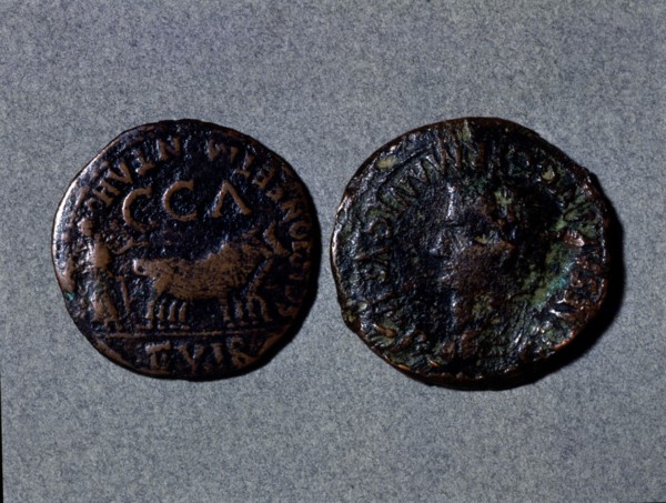 At left a coin with the legend 'Scipione er Montano II vir CCA', at right the front with the word?
