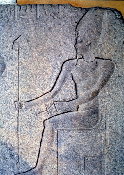 Detail of a stone engraving depicting a priest.