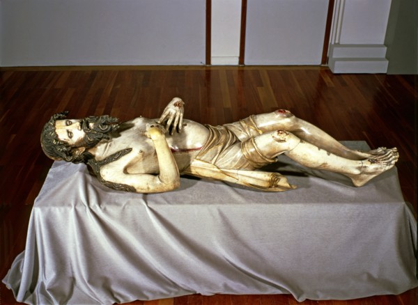 Christ lying in a St. Sepulchre, made in 1350 in alabaster, preserved in the church of Sant Feliu?