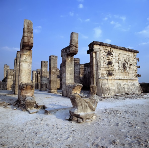 Chichen Itza, view of Temple of the Warriors, with a sculpture in foreground.