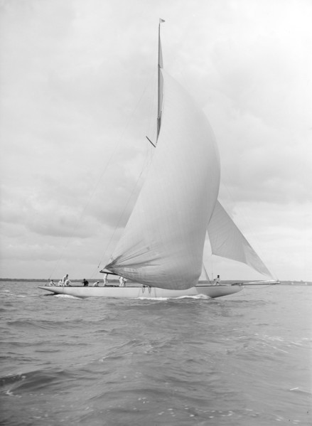 'Istria' sailing downwind under spinnaker, 1912.  Creator: Kirk & Sons of Cowes.