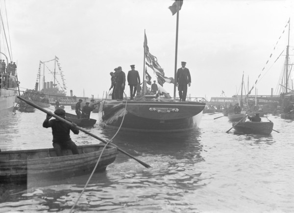 The launch of 'Shamrock IV' at Gosport, May 1914. Creator: Kirk & Sons of Cowes.