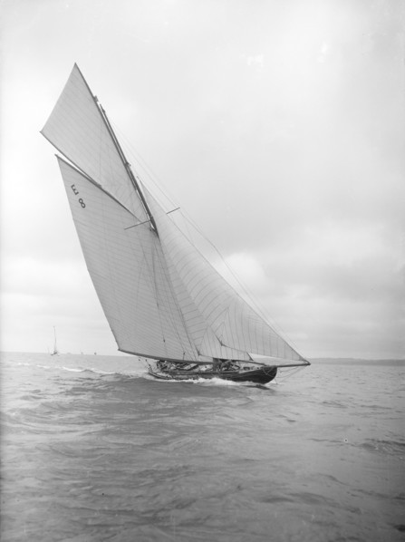 The 12 Metre sailing yacht 'Rollo' racing upwind, 1911. Creator: Kirk & Sons of Cowes.