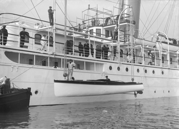 Lowering Liberty's motor launch, 1914. Creator: Kirk & Sons of Cowes.