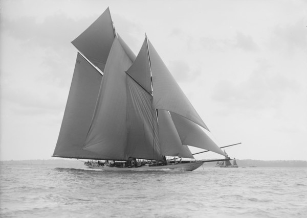 The 250 ton schooner 'Germania' sails on a reach, 1913. Creator: Kirk & Sons of Cowes.