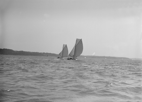 The 8 Metre sailing yachts 'Endrick' and 'Spero' racing downwind, 1911. Creator: Kirk & Sons of Cowes.