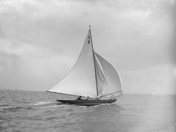 'Scotia IV' running downwind with spinnaker, 1913. Creator: Kirk & Sons of Cowes.