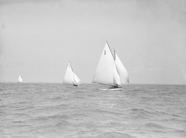 The 6 Metre 'The Whim' (L6) and 'Correnzia' racing downwind, 1911. Creator: Kirk & Sons of Cowes.
