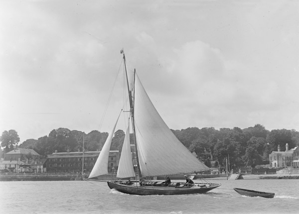 The 9 ton auxilary cutter 'Grayling' with  tender, 1921. Creator: Kirk & Sons of Cowes.