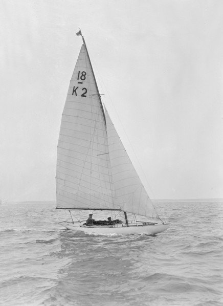 The 18-foot keelboat 'Prudence' (K2) under sail, 1922. Creator: Kirk & Sons of Cowes.