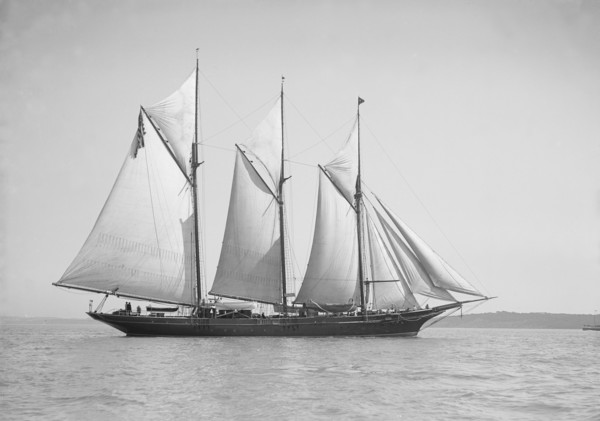The three-mast auxiliary schooner 'Invincible', 1911. Creator: Kirk & Sons of Cowes.