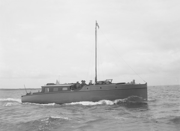 The motor yacht 'Cygnet' under way, 1922. Creator: Kirk & Sons of Cowes.