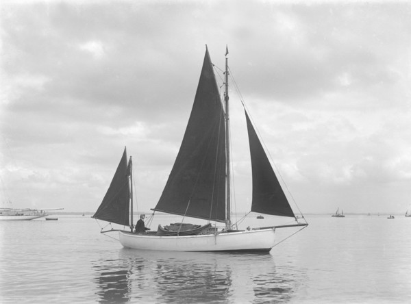 The 4 ton yawl 'Mandy' under sail, 1922. Creator: Kirk & Sons of Cowes.