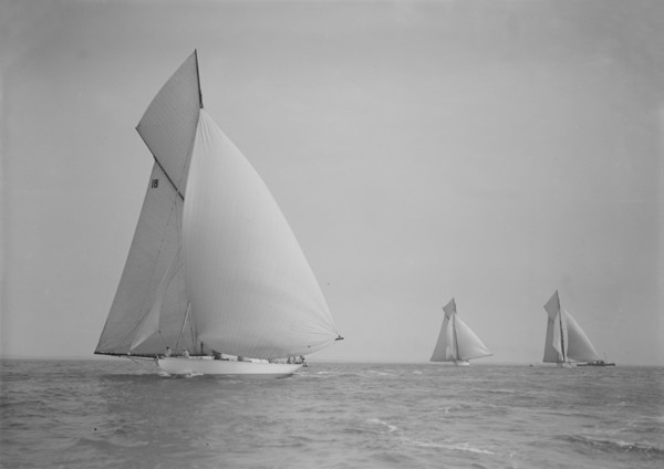 The cutter 'Onda' sailing under spinnaker, 1911. Creator: Kirk & Sons of Cowes.