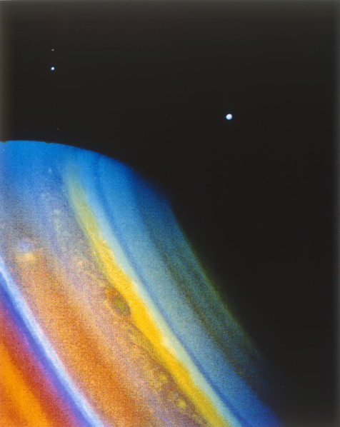 Saturn and its moon Dione, seen from the Voyager 2 spacecraft. Creator: NASA.