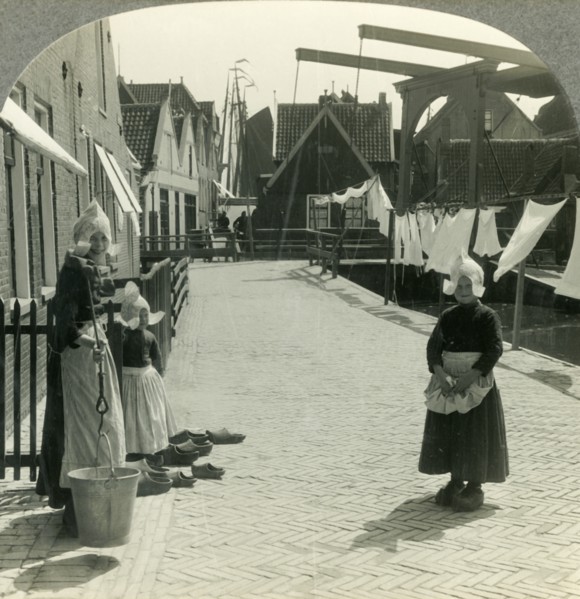 'Washday in Volendam, Netherlands - Shoes Large and Small and Some Who Wear Them', c1930s. Creator: Unknown.
