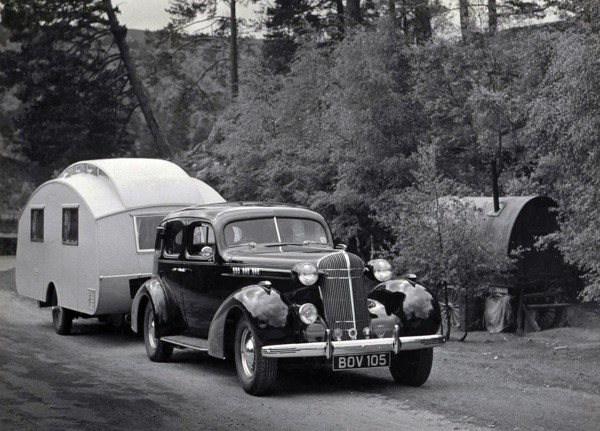 1936 Oldsmobile Eight with caravan in Scotland. Creator: Unknown.