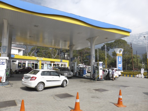 Cars re-fuelling at petrol station Dharamshala Himachal Pradesh. Creator: Unknown.