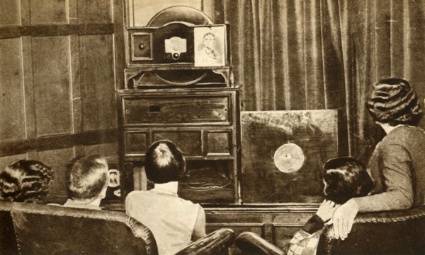 People watching an early television broadcast, c1930, (1933). Creator: Unknown.