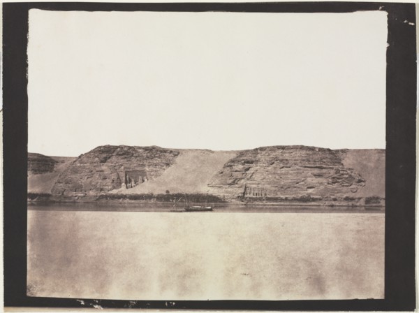 General View of Monuments Carved into Bedrock with Photographer's Dahabieh. Abu Simbel, 1851-1852. Creator: Félix Teynard (French, 1817-1892).