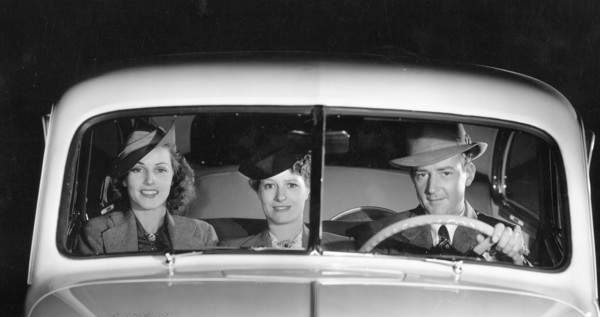 1939 Oldsmobile driver and female passengers. Creator: Unknown.