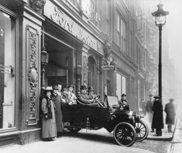 Ford Model T leaving showroom circa 1911. Creator: Unknown.