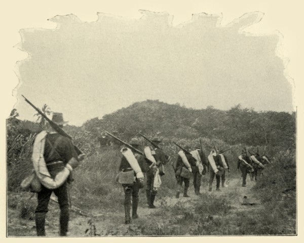 'On the Way from Battlefield of 1st and 10th to "Rough Riders" Scene of Conflict, over the Mountains Creator: Burr McIntosh.