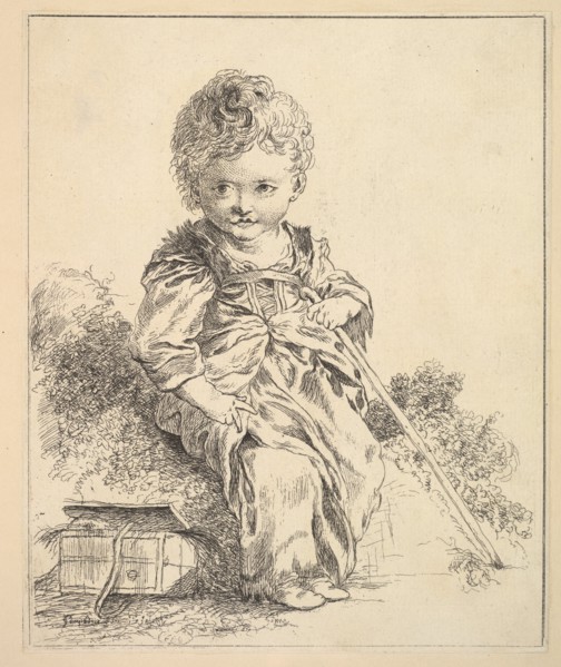 Un enfant assis sur une motte de terre