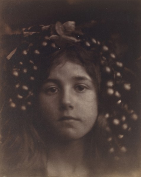 Circe, 1865. A child (Kate Keown) with grapes and leaves around her head, in close-up and slightly out of focus, with the subject looking straight into the camera. Circe is an ancient Greek enchantres...