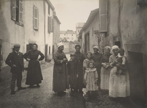 [Group of Adults and Children on a Village Street in the Auvergne], ca. 1910.