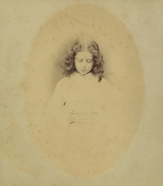 Edith Liddell Seated Beside a Vase of Foxgloves, 1860.