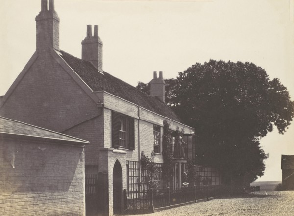 House with Woman on Balcony, Man Standing Below, ca. 1857.