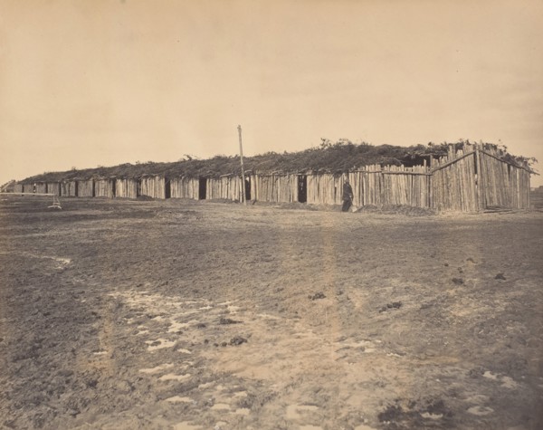 Civil War View, 1860s. (Section of log stalls [?] at City Point Virginia).