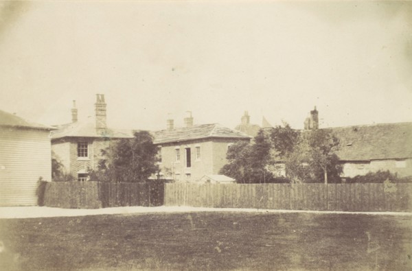 Compound of Buildings Surrounded by Fence, 1850s.