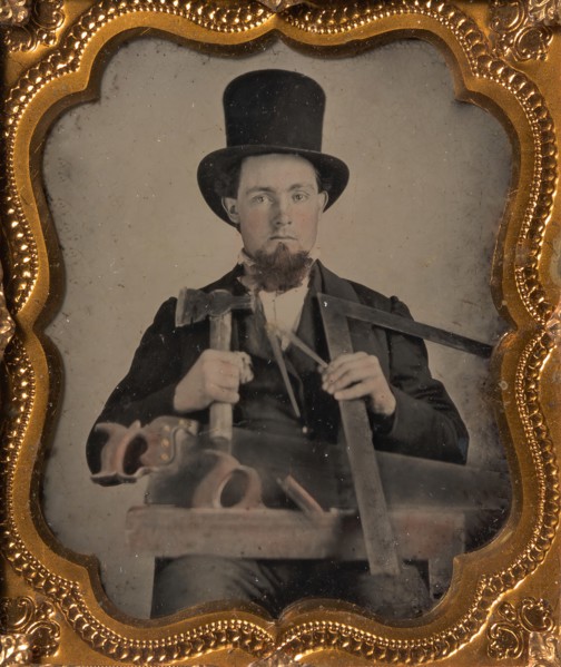 Carpenter in Top Hat with Hatchet, Compass, Square, and Hand Saw, 1850s-60s.