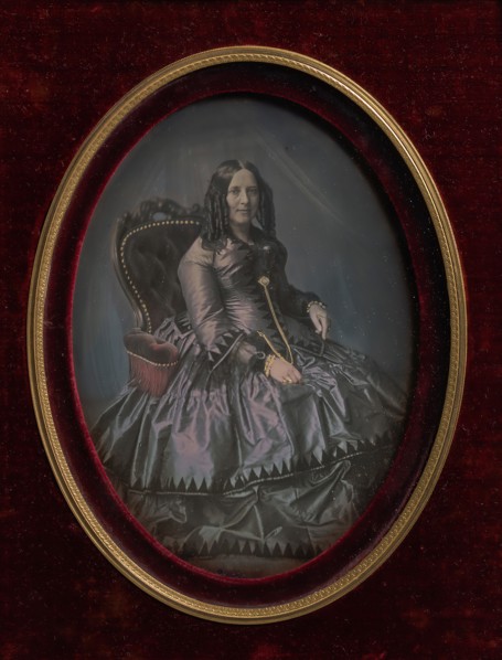 Finely Dressed Woman Seated in Armchair, 1850s.