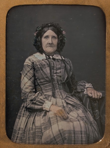 Seated Elderly Woman Wearing Plaid Dress and Bonnet, 1854-60.