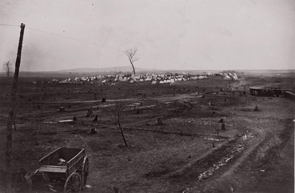 [Wagon in a landscape with army encampment in the distance]. Brady album, p. 125, 1861-65. Formerly attributed to Mathew B. Brady.