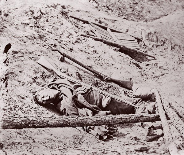 Dead Confederate Soldier at Fort Mahone, Petersburg, 1864. Formerly attributed to Mathew B. Brady.